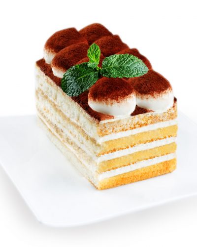 Tiramisu Cake On A White Plate Isolated
